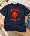 French Navy heavyweight T-shirt with red Orgazmo Donoras Lithuanian humour artwork, laid on a pale wooden bench beside jeans.
