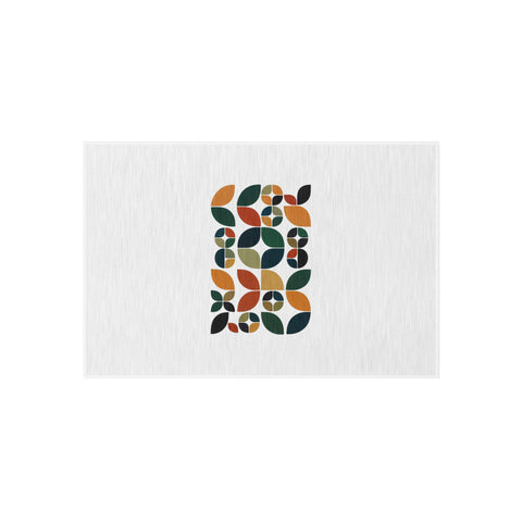 Retro Leaf Mosaic 24 × 36 inch white outdoor rug with complete centred arrangement of green, teal, mustard, orange and rust geometric leaves