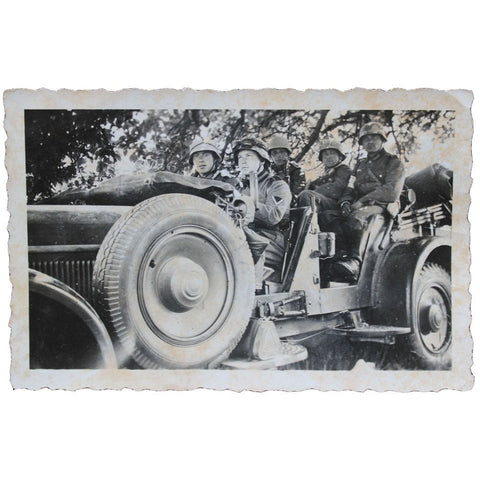 Photograph of German Soldiers in a Military Vehicle – WWII Era