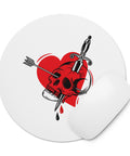 Pierced Skull Heart round mouse pad with one red-and-black tattoo-style design and a curled edge showing its unprinted underside.