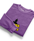 Folded purple Buddha Is My Homeboy cord sweatshirt with part of its single chest print visible.