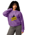 Second model wearing the purple Buddha Is My Homeboy oversized cord sweatshirt with its single front print visible.