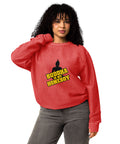 Second model wearing the red Buddha Is My Homeboy oversized cord sweatshirt with its single front print visible.