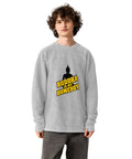 Model wearing the silver Buddha Is My Homeboy oversized cord sweatshirt, viewed from the printed front.