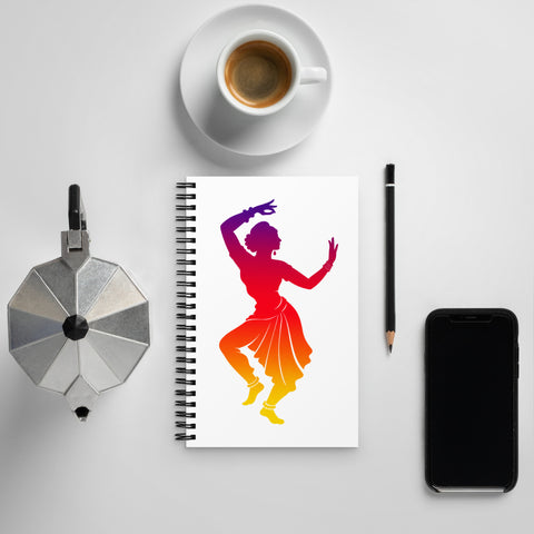 White spiral notebook with a centred classical dancer silhouette in purple, magenta, red, orange and yellow on the front – ZIPZAPPA