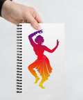 White spiral notebook with a centred classical dancer silhouette in purple, magenta, red, orange and yellow on the front – ZIPZAPPA