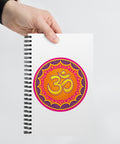 White spiral notebook with the original orange, pink, yellow and purple Om mandala centred on the front cover – ZIPZAPPA
