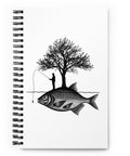 White spiral notebook with original black fisherman and tree standing on a giant fish island, centred in full on the front – ZIPZAPPA