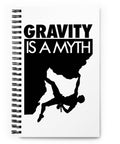 Original Gravity Is a Myth climber emblem on the front of a dotted spiral notebook – mockup 1 – ZIPZAPPA