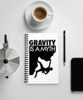 Original Gravity Is a Myth climber emblem on the front of a dotted spiral notebook – mockup 3 – ZIPZAPPA