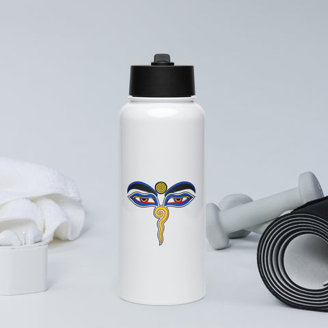 White 950 ml insulated straw water bottle with a colourful Buddha Wisdom Eyes emblem on the front, displayed beside exercise accessories.