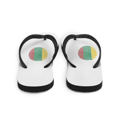 Lithuanian Fingerprint white flip-flops with red green and yellow prints and black straps – back view