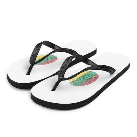 Lithuanian Fingerprint white flip-flops with red green and yellow prints and black straps – front-left view