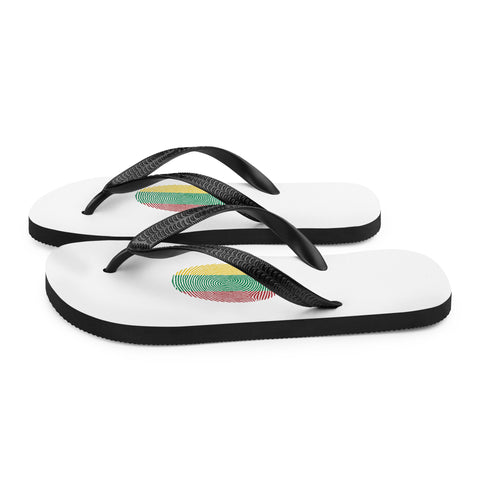 Lithuanian Fingerprint white flip-flops with red green and yellow prints and black straps – left side