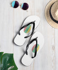 Lithuanian Fingerprint white flip-flops with red green and yellow prints and black straps – lifestyle view 1