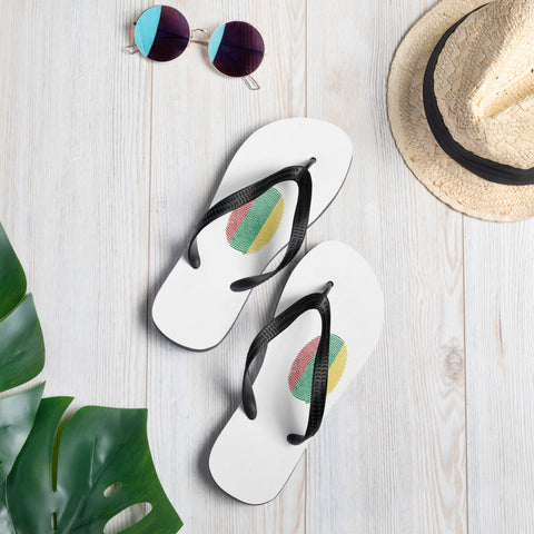 Lithuanian Fingerprint white flip-flops with red green and yellow prints and black straps – lifestyle view 1
