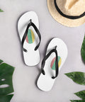 Lithuanian Fingerprint white flip-flops with red green and yellow prints and black straps – lifestyle view 2