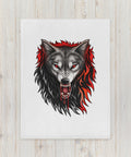 30 × 40 in Fire Wolf throw blanket laid on a pale wooden surface, showing the full centred wolf illustration.