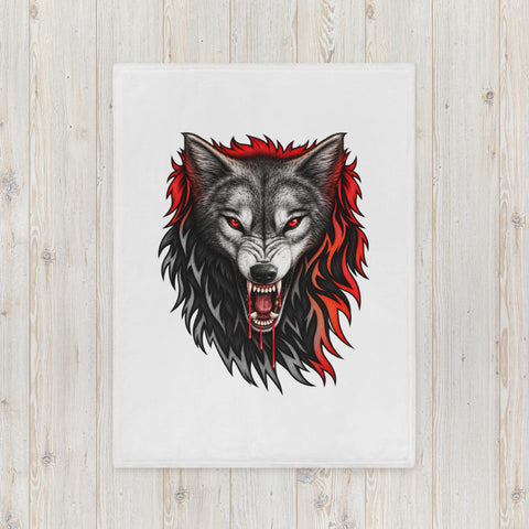 30 × 40 in Fire Wolf throw blanket laid on a pale wooden surface, showing the full centred wolf illustration.