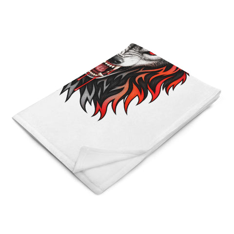 Folded 30 × 40 in Fire Wolf throw blanket viewed at an angle with part of the front wolf illustration visible.