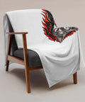 Fire Wolf throw blanket draped over a wooden armchair with the printed front visible.