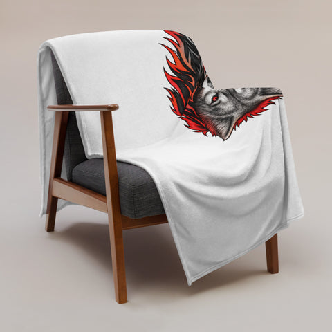 Fire Wolf throw blanket draped over a wooden armchair with the printed front visible.