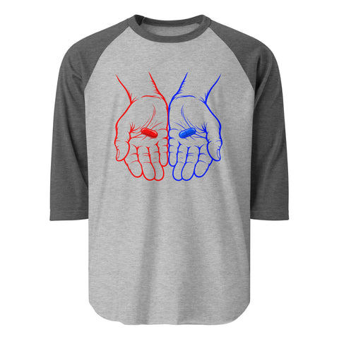 Front view of the Red or Blue Choice raglan shirt in Heather Grey/Heather Charcoal, with red and blue hands holding matching capsules on the front.