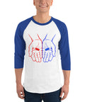 Model wearing the Red or Blue Choice raglan shirt in White/Royal, with red and blue hands holding matching capsules on the front.