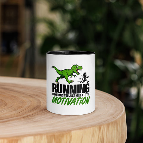 Front view of the 11 oz Dinosaur Motivation ceramic mug with black interior and handle on a round wooden table with softly blurred greenery, showing its single front design.