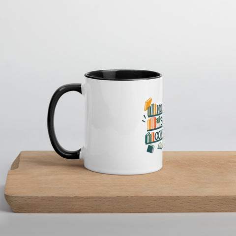 11 oz white No Shelf Control ceramic mug with black interior, rim and handle, left view on a wooden board; book illustration and green lettering printed once on the front.