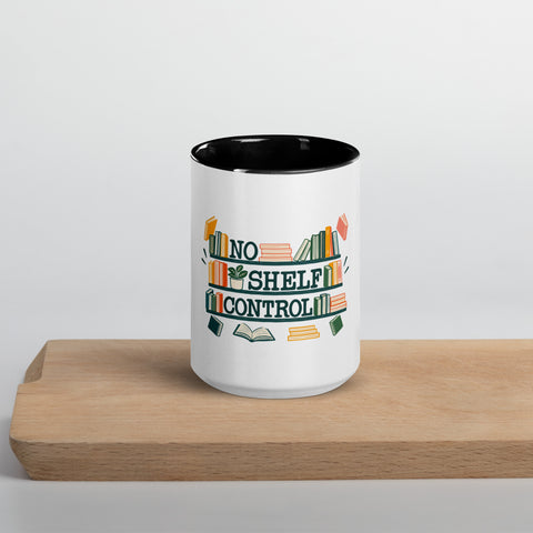 15 oz white No Shelf Control ceramic mug with black interior, rim and handle, front view on a wooden board; book illustration and green lettering printed once on the front.