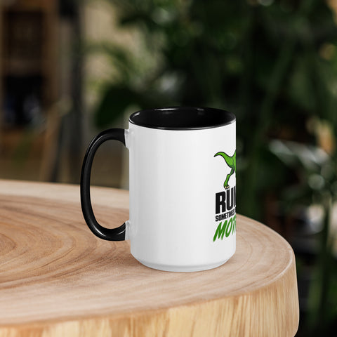 Left-side view of the 15 oz Dinosaur Motivation ceramic mug with black interior and handle on a round wooden table with softly blurred greenery, showing its single front design.
