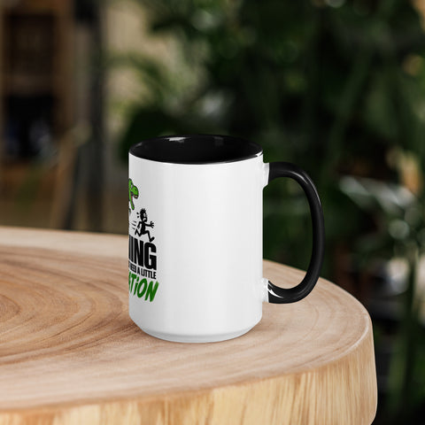 Right-side view of the 15 oz Dinosaur Motivation ceramic mug with black interior and handle on a round wooden table with softly blurred greenery, showing its single front design.