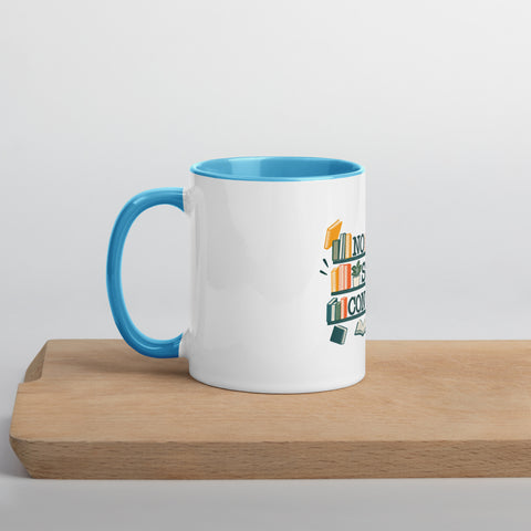 11 oz white No Shelf Control ceramic mug with blue interior, rim and handle, left view on a wooden board; book illustration and green lettering printed once on the front.