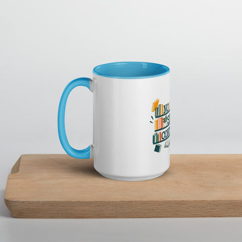 15 oz white No Shelf Control ceramic mug with blue interior, rim and handle, left view on a wooden board; book illustration and green lettering printed once on the front.