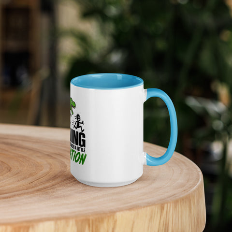 Right-side view of the 15 oz Dinosaur Motivation ceramic mug with blue interior and handle on a round wooden table with softly blurred greenery, showing its single front design.