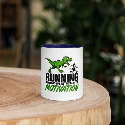 Front view of the 11 oz Dinosaur Motivation ceramic mug with dark blue interior and handle on a round wooden table with softly blurred greenery, showing its single front design.