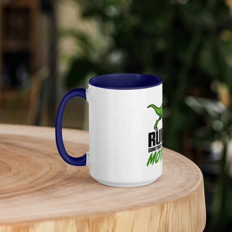 Left-side view of the 15 oz Dinosaur Motivation ceramic mug with dark blue interior and handle on a round wooden table with softly blurred greenery, showing its single front design.