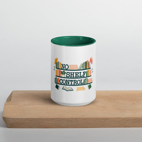 15 oz white No Shelf Control ceramic mug with dark green interior, rim and handle, front view on a wooden board; book illustration and green lettering printed once on the front.