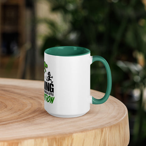 Right-side view of the 15 oz Dinosaur Motivation ceramic mug with dark green interior and handle on a round wooden table with softly blurred greenery, showing its single front design.