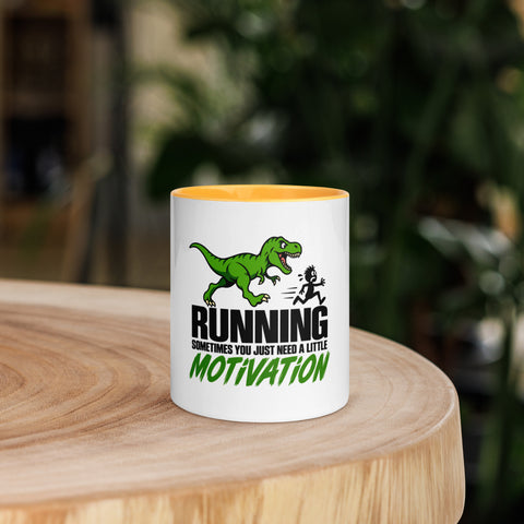 Front view of the 11 oz Dinosaur Motivation ceramic mug with golden yellow interior and handle on a round wooden table with softly blurred greenery, showing its single front design.