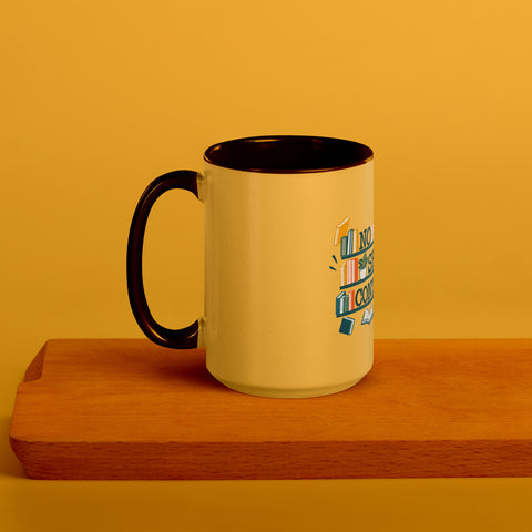 15 oz white No Shelf Control ceramic mug with golden yellow interior, rim and handle, left view on a wooden board; book illustration and green lettering printed once on the front.