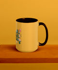 15 oz white No Shelf Control ceramic mug with golden yellow interior, rim and handle, right view on a wooden board; book illustration and green lettering printed once on the front.