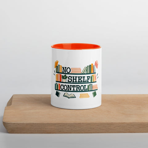 11 oz white No Shelf Control ceramic mug with orange interior, rim and handle, front view on a wooden board; book illustration and green lettering printed once on the front.