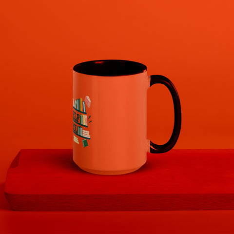 15 oz white No Shelf Control ceramic mug with orange interior, rim and handle, right view on a wooden board; book illustration and green lettering printed once on the front.