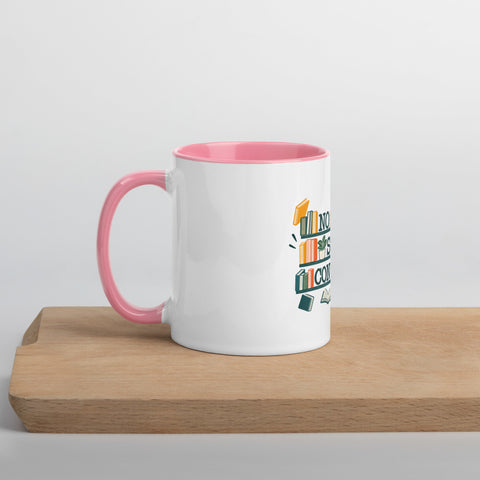 11 oz white No Shelf Control ceramic mug with pink interior, rim and handle, left view on a wooden board; book illustration and green lettering printed once on the front.