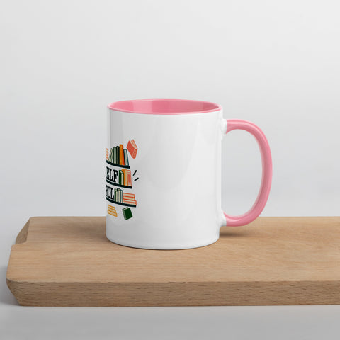11 oz white No Shelf Control ceramic mug with pink interior, rim and handle, right view on a wooden board; book illustration and green lettering printed once on the front.