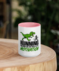 Front view of the 15 oz Dinosaur Motivation ceramic mug with pink interior and handle on a round wooden table with softly blurred greenery, showing its single front design.