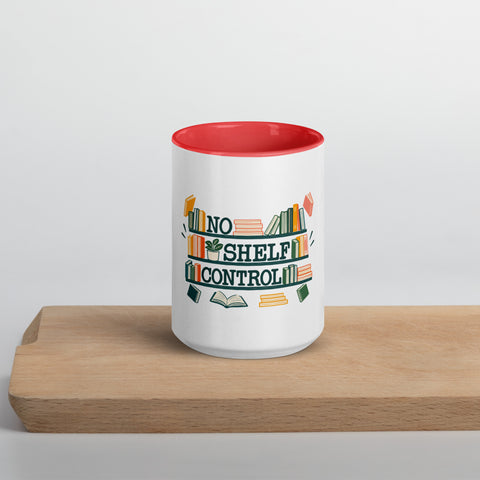 15 oz white No Shelf Control ceramic mug with red interior, rim and handle, front view on a wooden board; book illustration and green lettering printed once on the front.