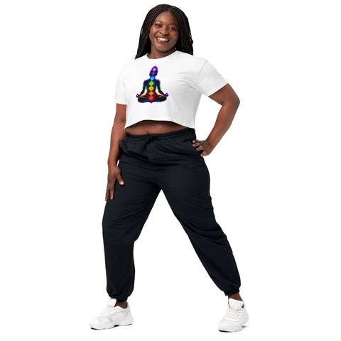 White women's cotton crop top, with original luminous rainbow chakra meditation silhouette printed on the front.